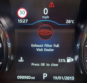 Dashboard displaying an Exhaust Filter Full warning on a diesel vehicle